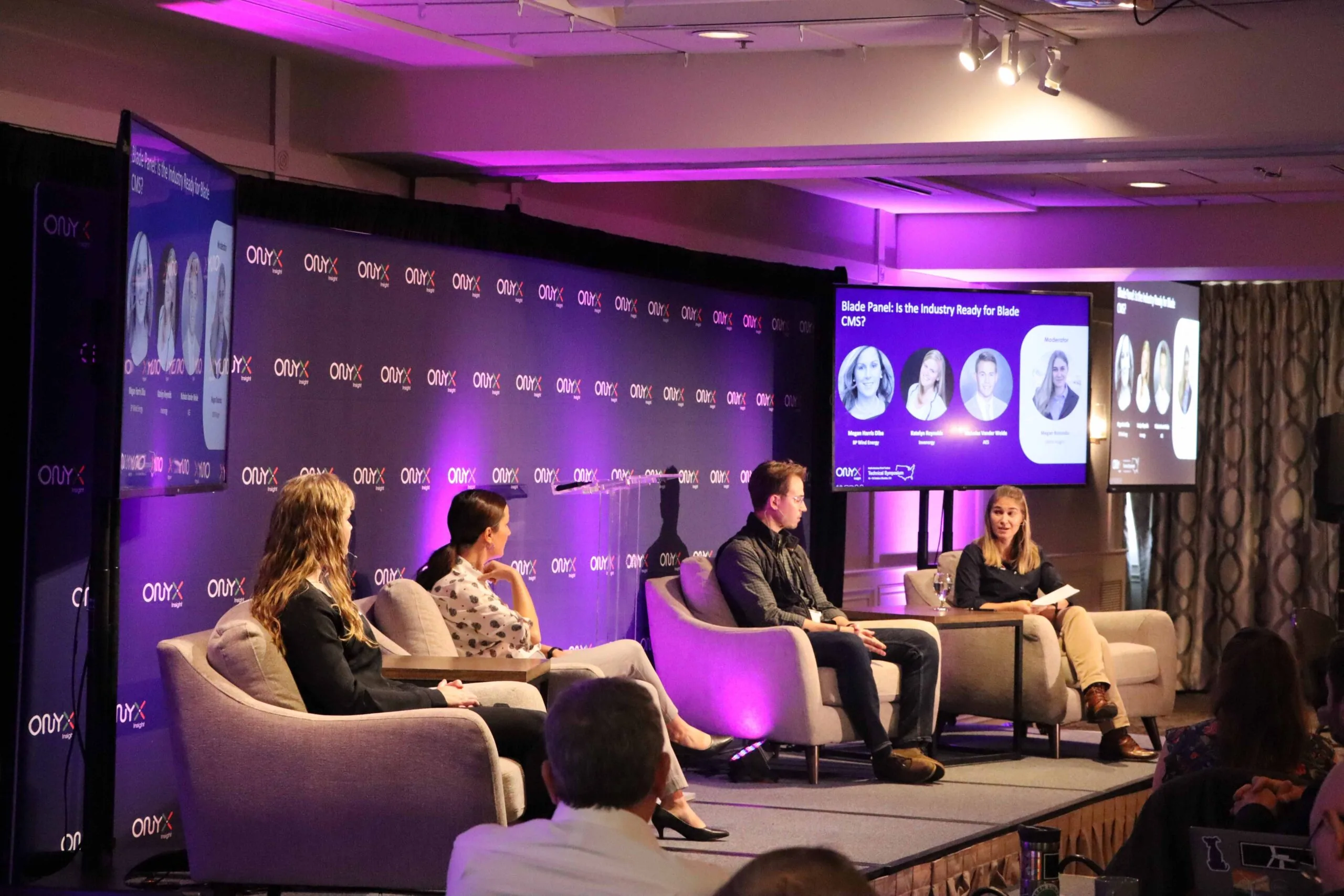 An Earth Coast Productions stage build — lighting, LED wall, and broadcast cameras at a Colorado corporate event